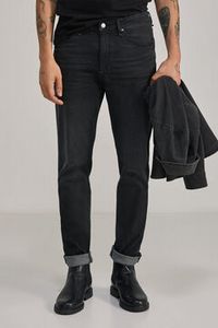 Oferta de Jeans slim ligero negro lavado por 39,99€ en Springfield