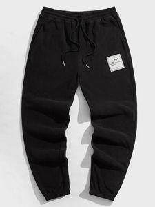 Oferta de SHEIN Hombres Pantalones de cintura con cordón con diseño de parche forro polar por 11€ en SheIn